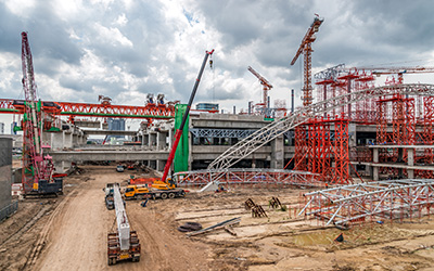 Construction Cranes Working on Expressway and Skytrain Site in A